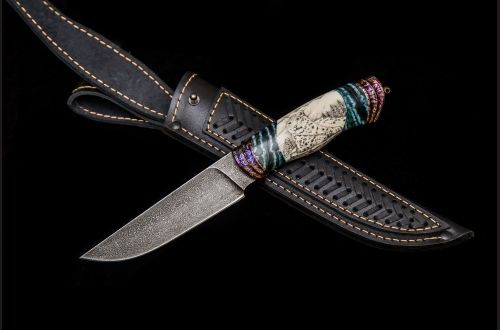 Авторский нож "Снежный барс" <span>(Мозаичный дамаск с никелем, клык моржа, вставки стабилизированный зуб мамонта, художественное оформление рукояти с 2-х сторон - скримшоу)</span>