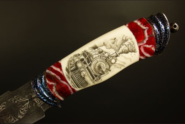 Авторский нож "Дикий Запад" <span>(Мозаичный дамаск, в режущей кромке 20000 слоёв, клык моржа, вставки стабилизированный зуб мамонта, мозаичный дамаск, художественное оформление рукояти - скримшоу)</span>